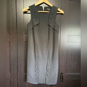 Classic style sleeveless dress with button detail.